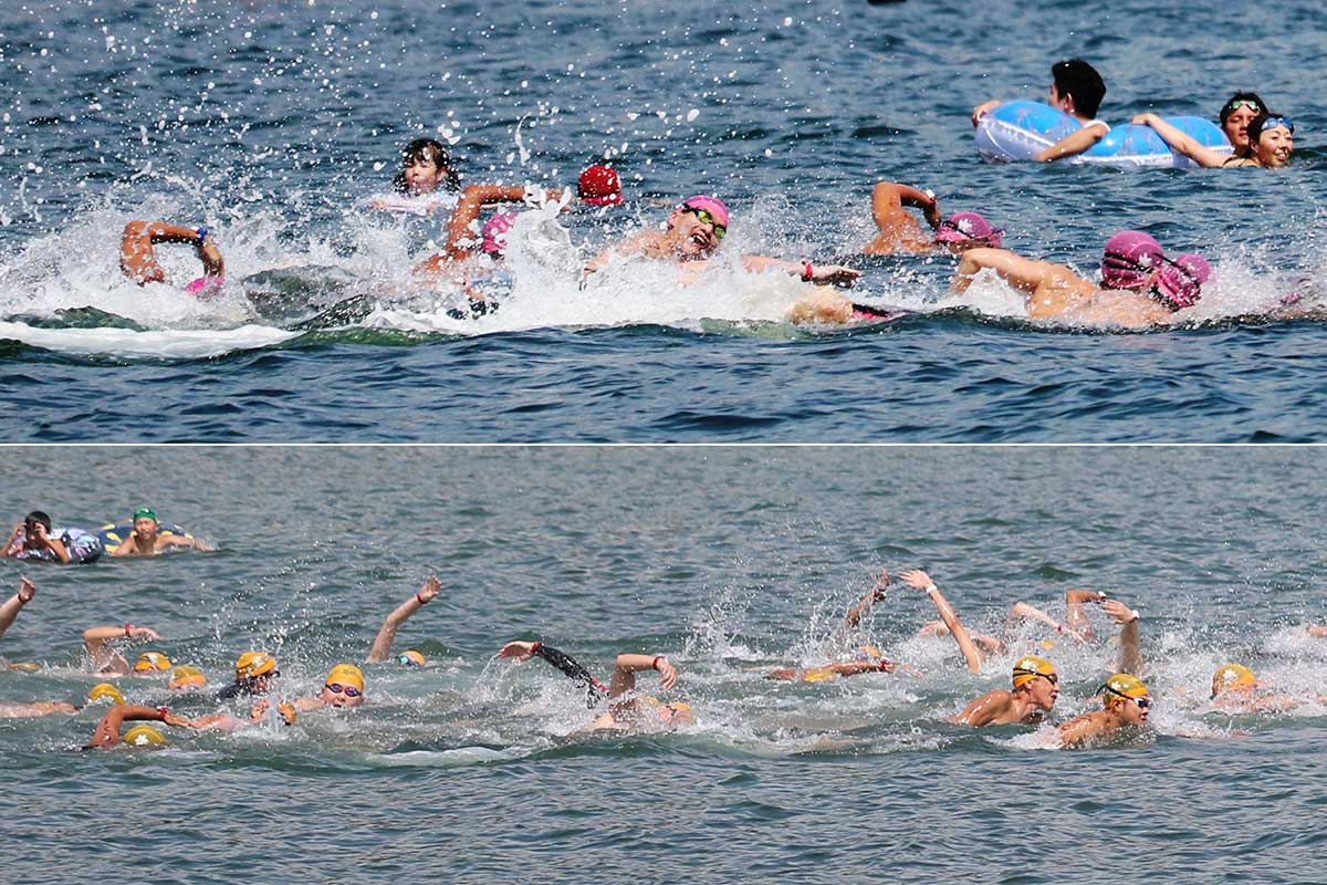 水しぶきを上げ、沖の周回コースに向かう5キロの部の選手。写真上は日本選手権トライアル