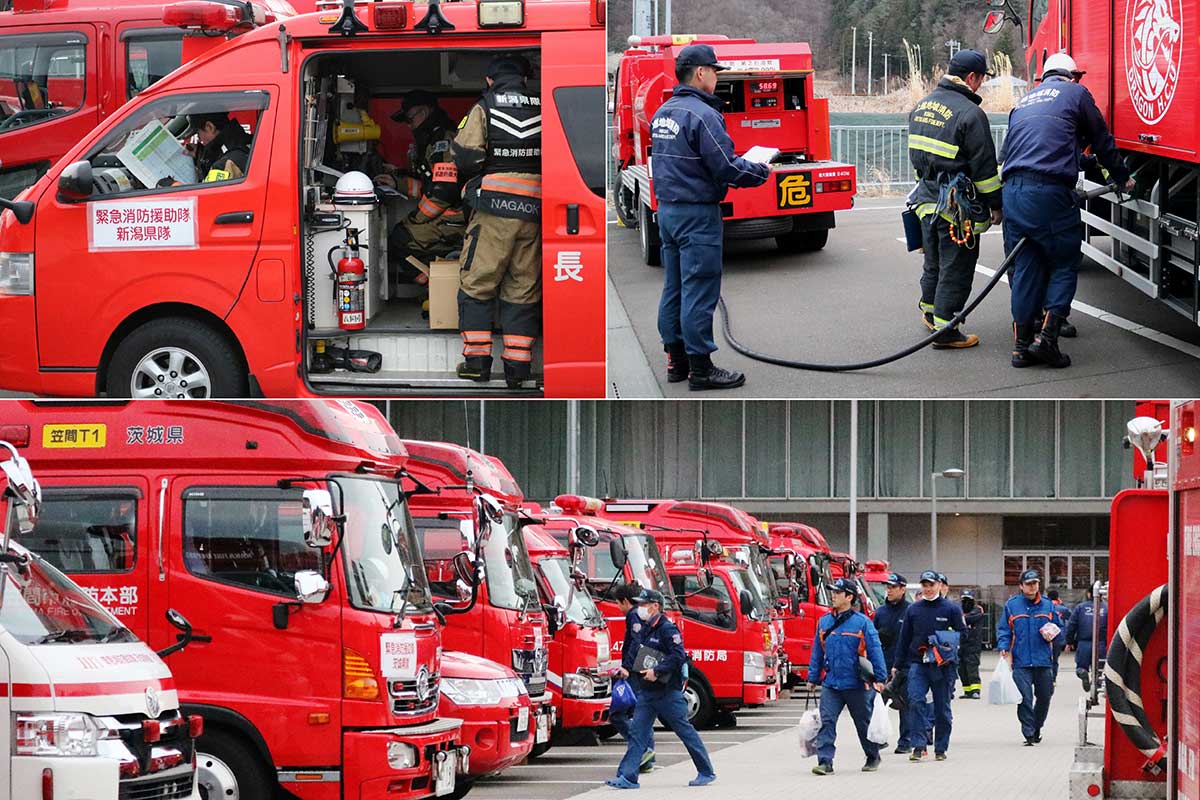 大船渡市の山林火災現場への出動を前に準備を整える隊員ら＝3日、午前6時半ごろ