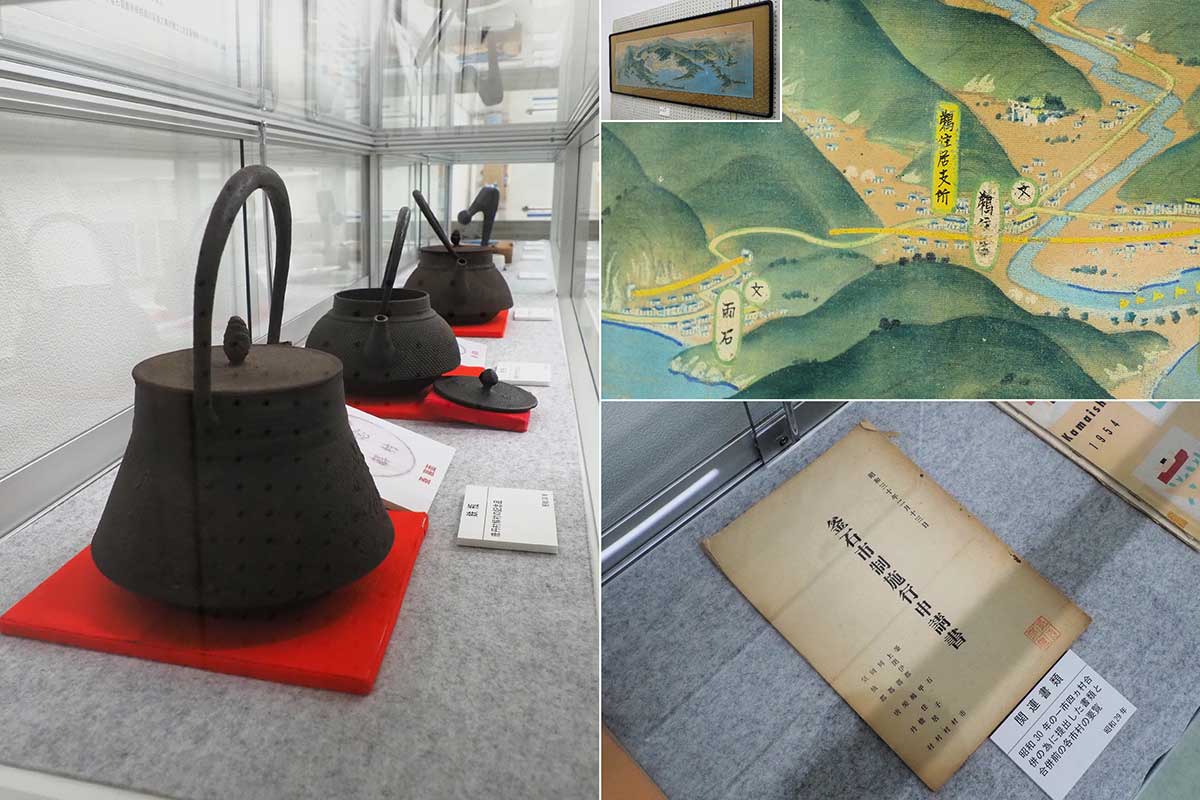 合併を記念した鳥瞰図や鉄瓶、申請書など貴重な資料が並ぶ
