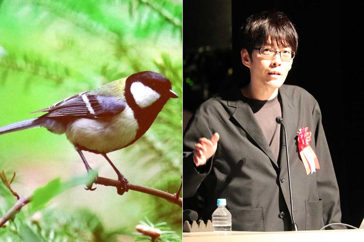 シジュウカラに言葉があることを発見した東京大先端科学技術研究センターの鈴木俊貴准教授（右）。組合40周年記念で講演した